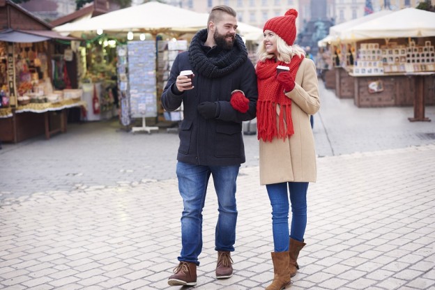 Couple walking around the christmas market